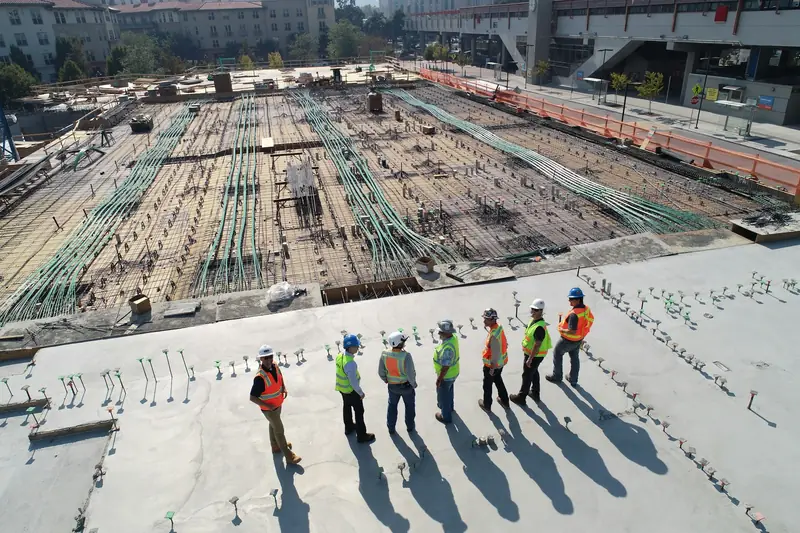 Construction team in safety gear inspecting a project site